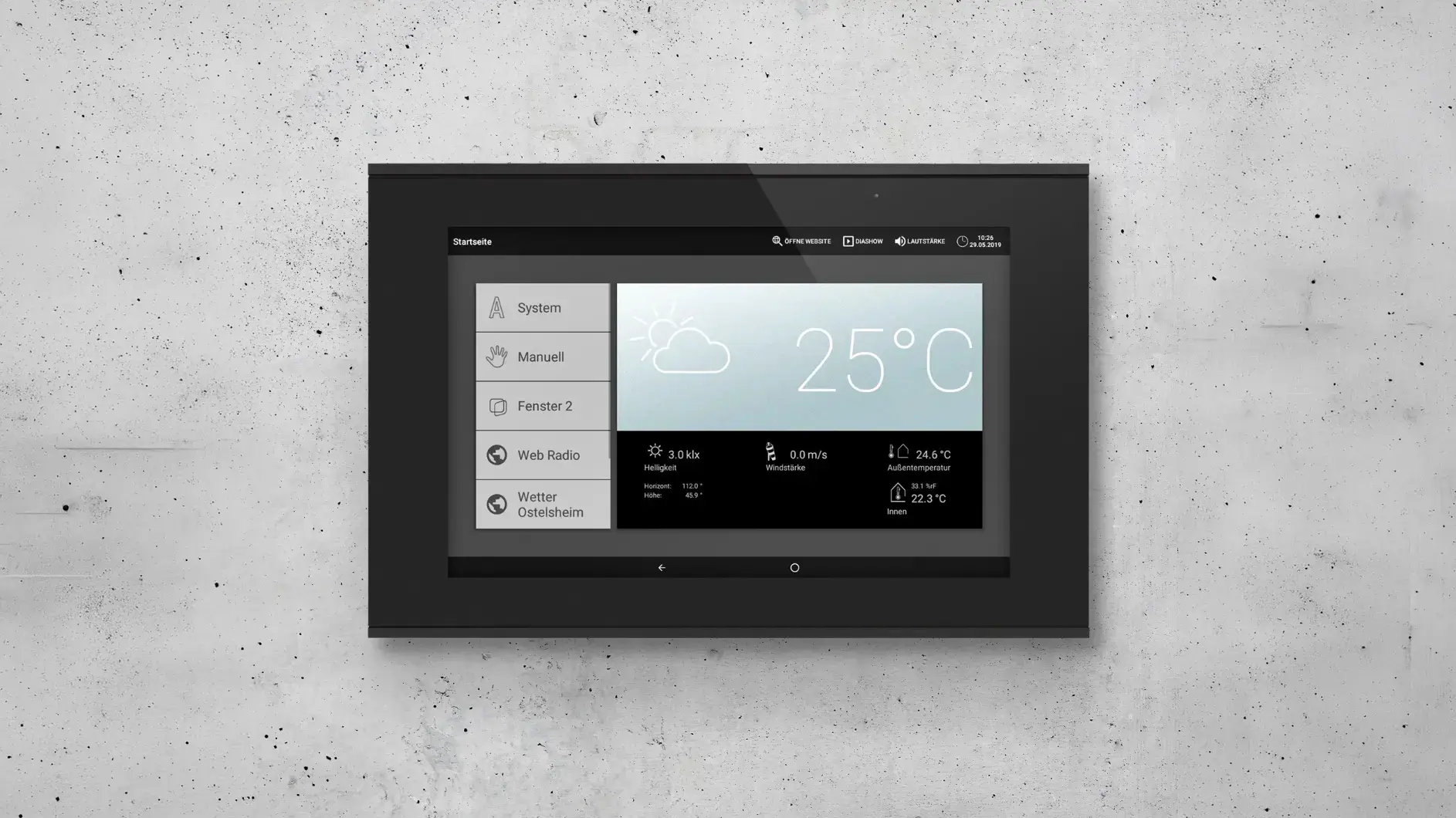 An Elsner Elektronik smart home control panel on a concrete wall
