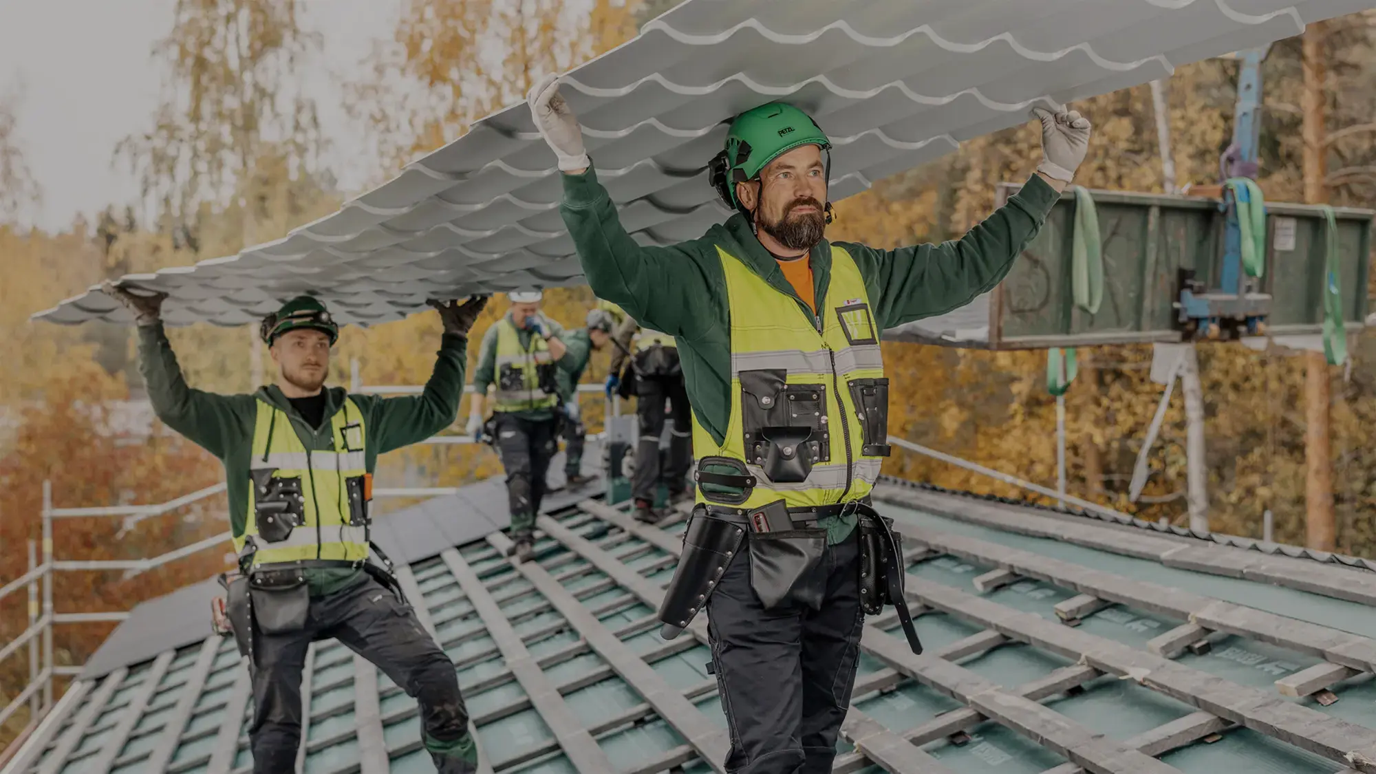 Vesivek roofers installing a metal roof